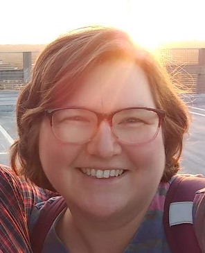 Close up of smiling female face wearing glasses